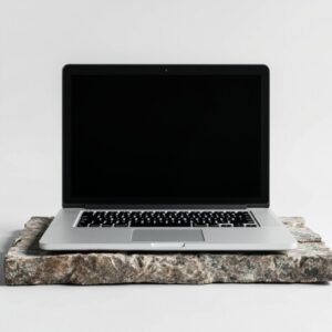 Silver-Laptop-on-Stone-Slab-with-Black-Screen_IJ9wK